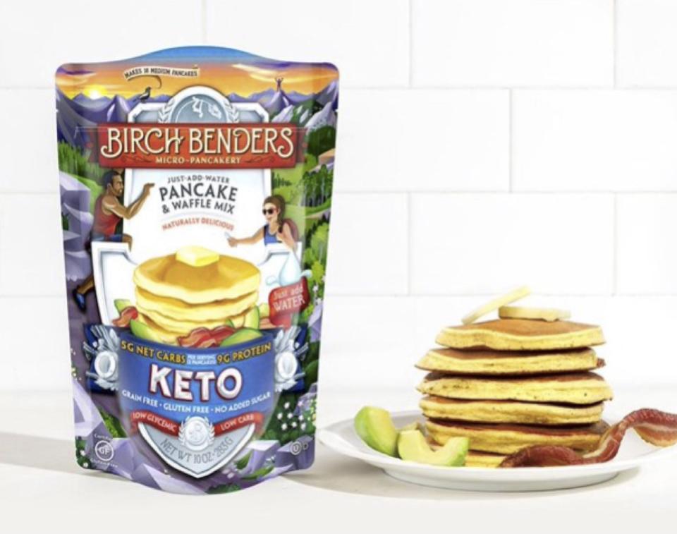 Birch Benders Keto pancake mix package shown next to a stack of pancakes on a plate. 