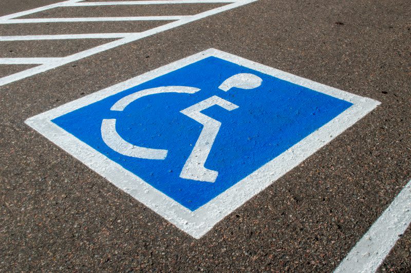 Empty parking spot within a parking lot with handicapped parking symbol. (Getty)