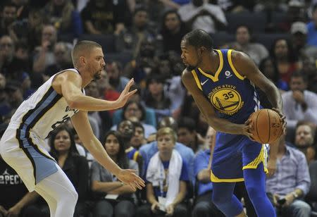 Oct 21, 2017; Memphis, TN, USA; Golden State Warriors forward Kevin Durant (35) handles the ball against Memphis Grizzlies forward Chandler Parsons (25) during the first half at FedExForum. Mandatory Credit: Justin Ford-USA TODAY Sports