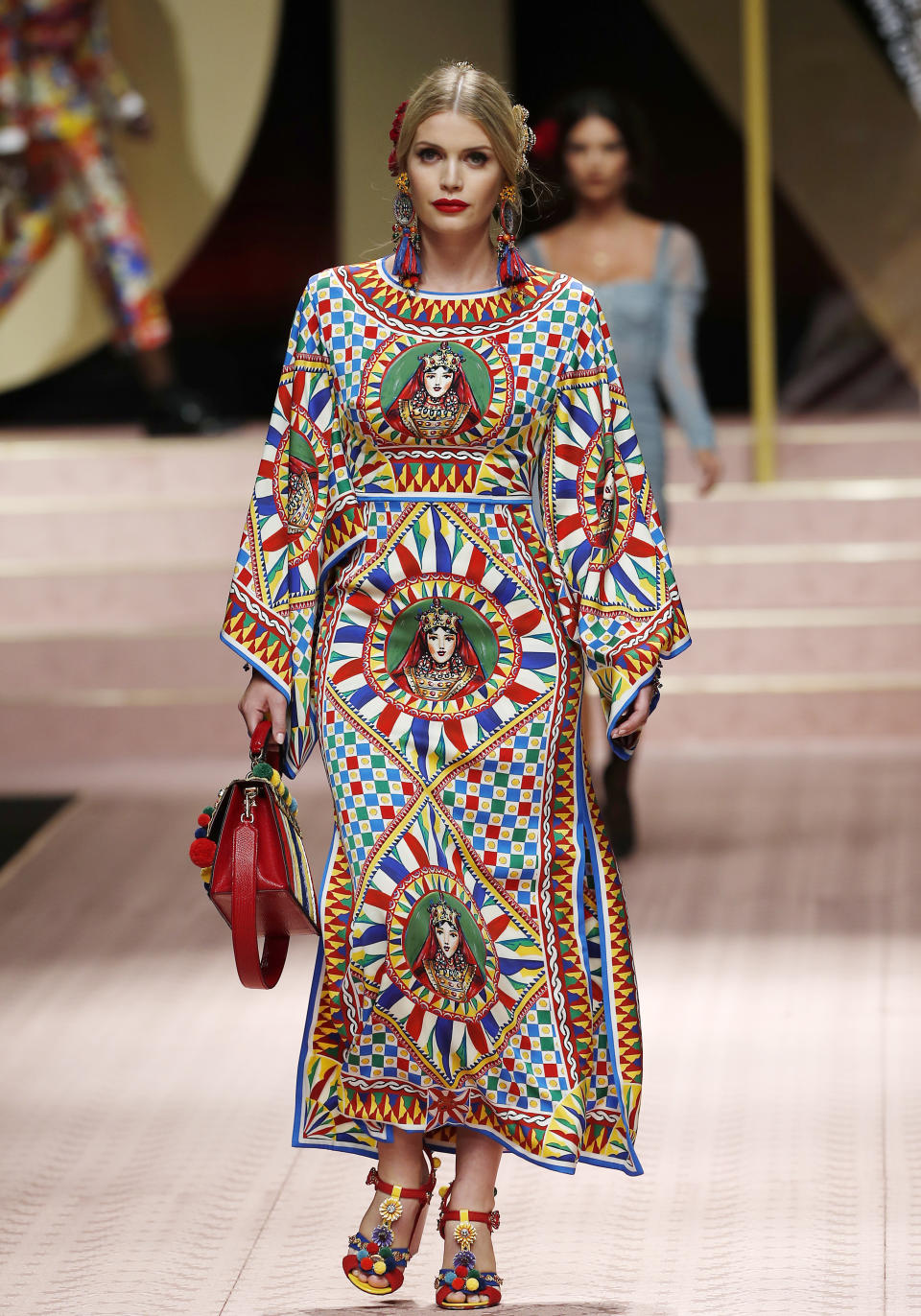 Kitty Spencer wears a creation as part of the Dolce & Gabbana women's 2019 Spring-Summer collection, unveiled during the Fashion Week in Milan, Italy, Sunday, Sept. 23, 2018. (AP Photo/Antonio Calanni)