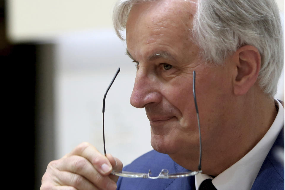 The European Union's chief Brexit negotiator Michel Barnier adjusts his glasses after talks to the media with Cyprus' foreign minister Nicos Christodoulides at the foreign ministry in Nicosia, Cyprus, Monday, May 20, 2019. Barnier says ratifying the withdrawal agreement is the only way for the UK to give itself time to figure out with the bloc what to do about a border with Northern Ireland. (AP Photo/Petros Karadjias)