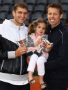 PARIS, FRANCE - JUNE 09: Max Mirnyi (L) of Belarus and Daniel Nestor of Canada pose with Nestor's daughter Tiana after defeating Bob and Mike Bryan of the USA in the men's doubles final during day 14 of the French Open at Roland Garros on June 9, 2012 in Paris, France. (Photo by Matthew Stockman/Getty Images)