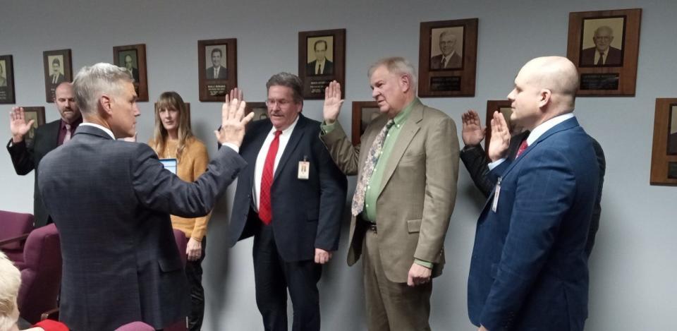 From left, Wayne Highlands school board members taking the oath of office on Dec. 5, 2023: Brian Weist, Tanya Gibbs-Hinkley, George Korb, David Stanton, Travis Samson, Matthew Corso. Tom Fasshauer is administering the oath of office.