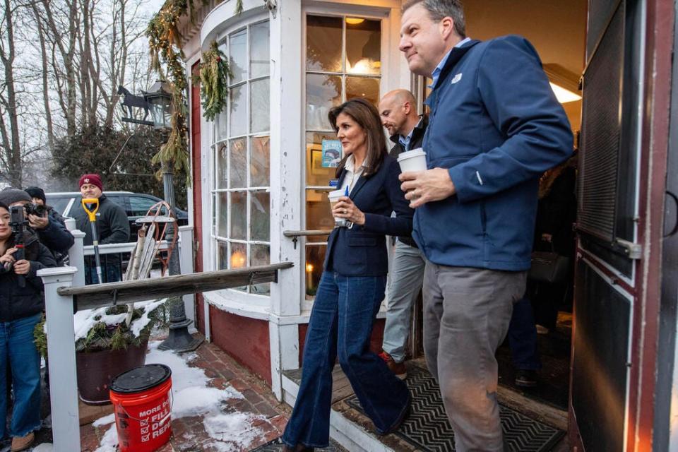 Former UN Ambassador and 2024 presidential hopeful Nikki Haley and New Hampshire Governor Chris Sununu (R) exit Newfields Country Store after a get-out-the-vote campaign stop in Newfields, New Hampshire, on January 19, 2024. The state's primary is scheduled for January 23, 2024. (Photo by Joseph Prezioso / AFP) (Photo by JOSEPH PREZIOSO/AFP via Getty Images) ORIG FILE ID: 1937373955