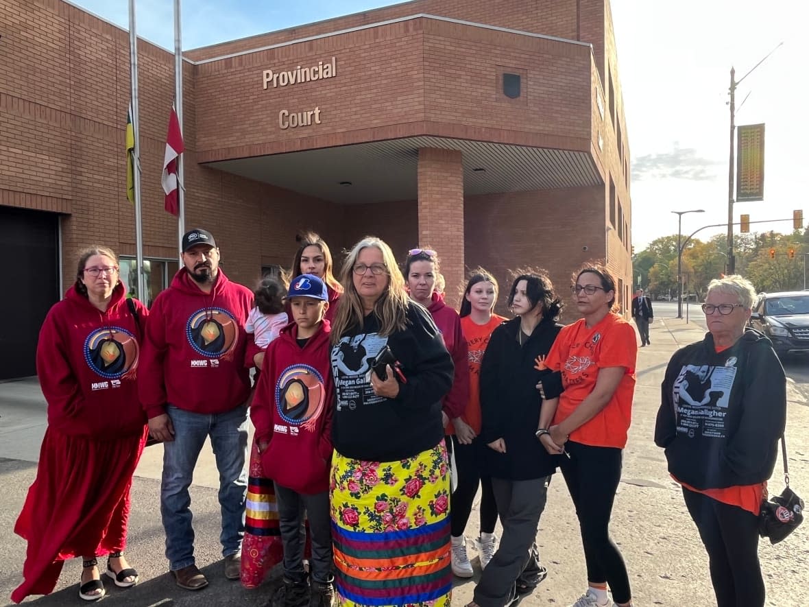 The family of Megan Gallagher, a missing 30-year-old from Saskatoon, gathered at Saskatoon provincial court Friday morning for the appearance of a man accused of unlawful confinement and aggravated assault in relation to her disappearance. (Dayne Patterson/CBC - image credit)