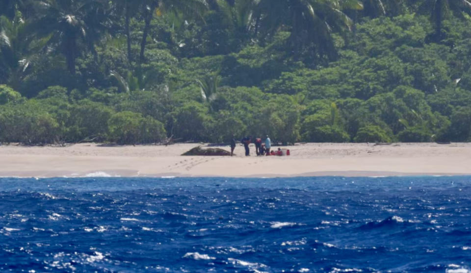 The marooned sailors, shortly before being picked up by the USCG. Photo: USCG