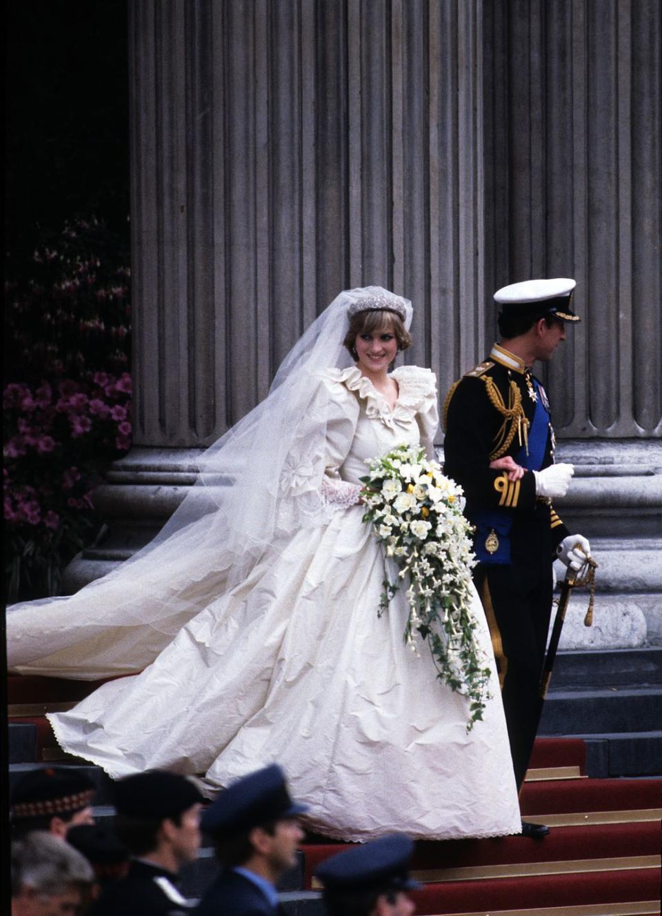 <p>Princess Diana's gown is arguably the most iconic wedding gown in history. The dramatic white dress was designed by David and Elizabeth Emanuel and featured a ruffled collar, long sleeves, and fabric for days.</p>