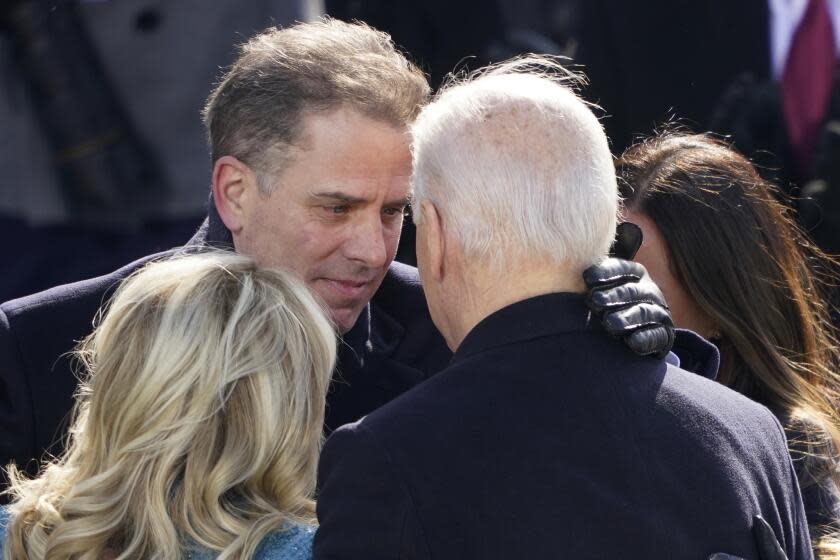 FILE - President Joe Biden hugs first lady Jill Biden, his son Hunter Biden and daughter Ashley Biden after being sworn-in during the 59th Presidential Inauguration at the U.S. Capitol in Washington, Jan. 20, 2021. A federal grand jury has heard testimony in recent months about Hunter Biden's income and payments he received while serving on the board of an Ukraine energy company. That's according to two people familiar with the probe. (AP Photo/Carolyn Kaster, File)