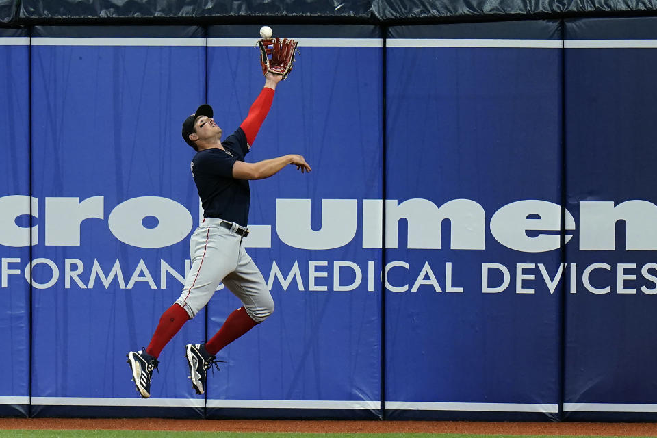 Boston Red Sox right fielder Hunter Renfroe makes a leaping catch on a fly ball by Tampa Bay Rays' Ji-Man Choi during the fifth inning of a baseball game Thursday, June 24, 2021, in St. Petersburg, Fla. (AP Photo/Chris O'Meara)