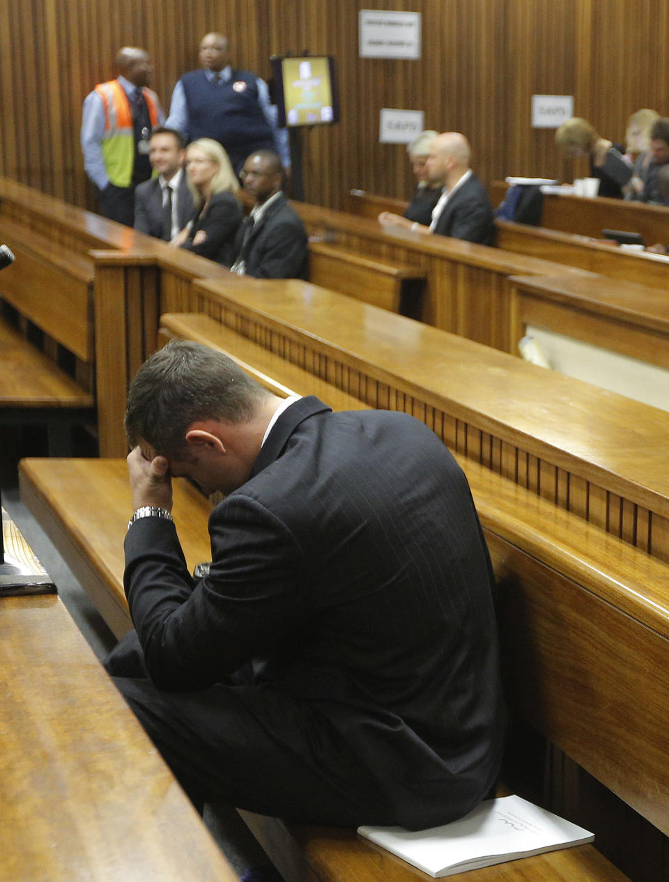 Oscar Pistorius, in the dock on the second day of his trial at the high court in Pretoria, South Africa, Tuesday, March 4, 2014. Pistorius is charged with murder for the shooting death of his girlfriend, Reeva Steenkamp, on Valentines Day in 2013. (AP Photo/Kim Ludbrook, Pool)