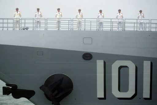 Sailors stand on the deck of the new Chinese guided-missile destroyer Nanchang as Beijing showed off its growing fleet on April 23, 2019 in the sea off eastern China's Shandong province