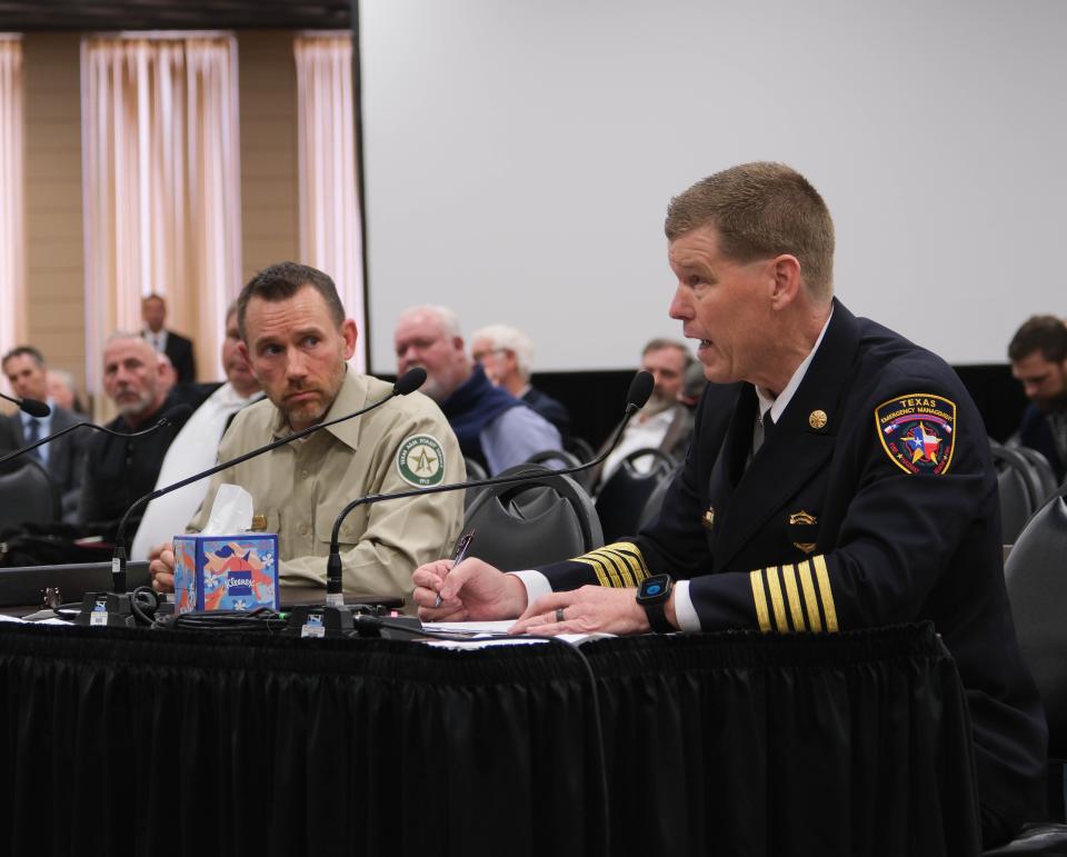 Nim Kidd (right) chief of the Texas Division of Emergency Management, addresses the Panhandle Wildfire Investigative Committee Tuesday in Pampa.