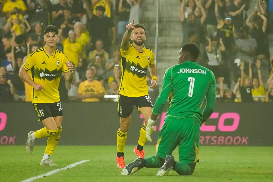 Jul 6, 2024; Columbus, OH, USA; Columbus Crew forward Diego Rossi (10) celebrates scoring a goal in front of Toronto FC goalkeeper Sean Johnson (1) during the second half of the MLS soccer match at Lower.com Field. The Crew won 4-0.