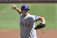 Texas Rangers pitcher Dane Dunning delivers to the Baltimore Orioles in the first inning of a baseball game Sunday, Sept. 26, 2021, in Baltimore. (AP Photo/Gail Burton)