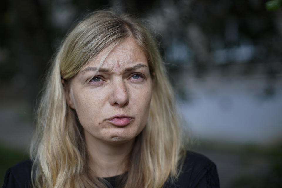 Elena German reacts as she speaks during her interview with the Associated Press in Minsk, Belarus, Saturday, Aug. 15, 2020. Alexander Taraikovsky's life-partner Elena German told The Associated Press on Saturday that she is sure her 34-year-old mate was shot by police. German spoke a few hours before Taraikovsky's funeral and burial, an event that could reinforce the anger of demonstrators who for the past have protested what they consider a sham presidential election and the violent police response to their protests. (AP Photo/Mstyslav Chernov)