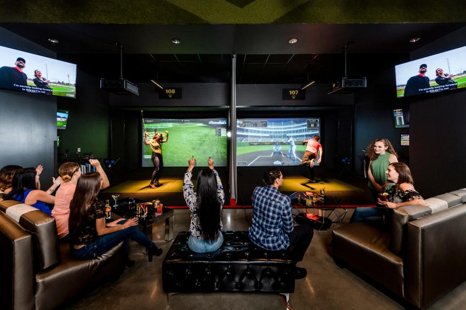 Topgolf Swing Suite’s simulator bays offer a variety of virtual sports experiences.