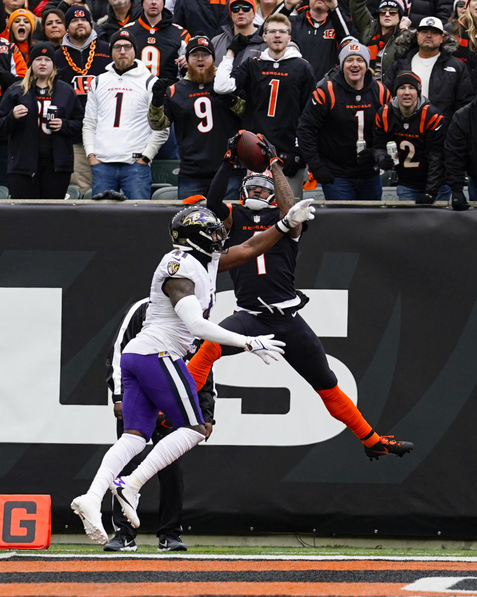 Cincinnati Bengals wide receiver Ja'Marr Chase (1) makes a catch over Baltimore Ravens cornerback Daryl Worley (41) for a touchdown in the first half of an NFL football game in Cincinnati, Sunday, Jan. 8, 2023. (AP Photo/Jeff Dean)