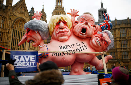 A van carrying large caricatures of politicians drives past the Houses of Parliament in London, Britain, December 10, 2018. REUTERS/Henry Nicholls