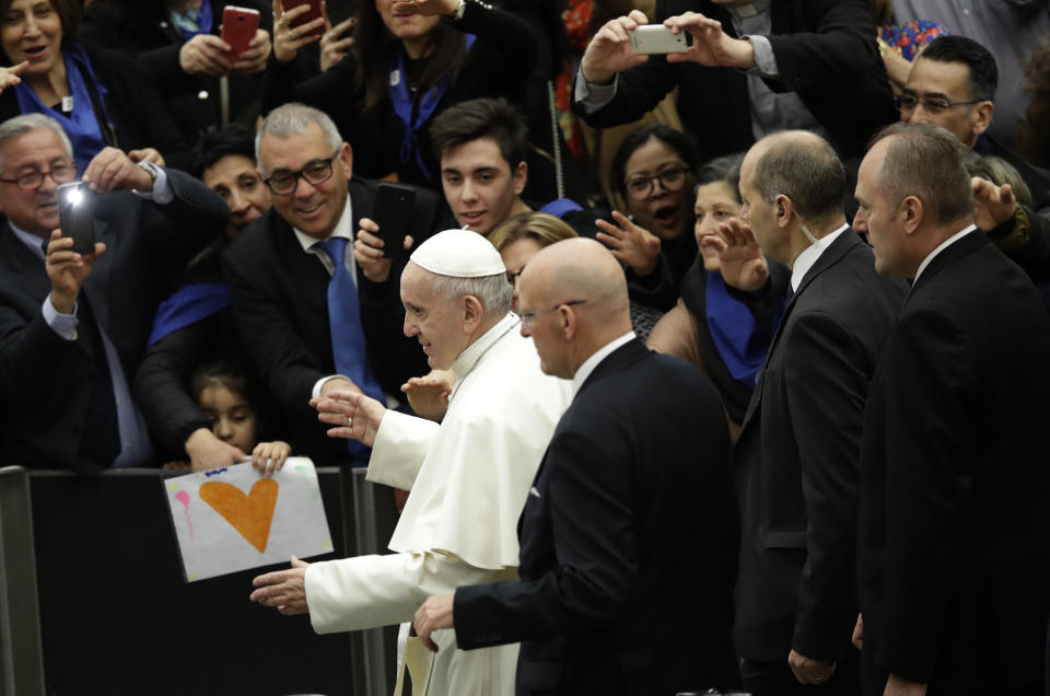 Pope Francis leaves at the end of his weekly general audience in the Paul VI Hall at the Vatican, Wednesday, Feb. 20, 2019. (AP Photo/Alessandra Tarantino)