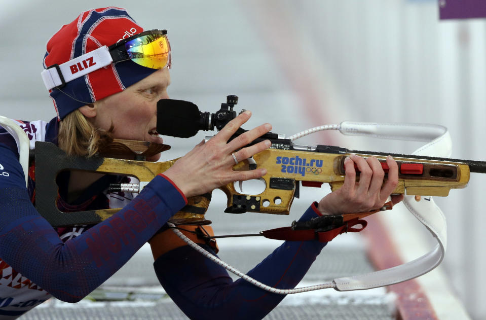 Norway's Tora Berger shoots during the women's biathlon 15k individual race, at the 2014 Winter Olympics, Friday, Feb. 14, 2014, in Krasnaya Polyana, Russia. (AP Photo/Lee Jin-man)