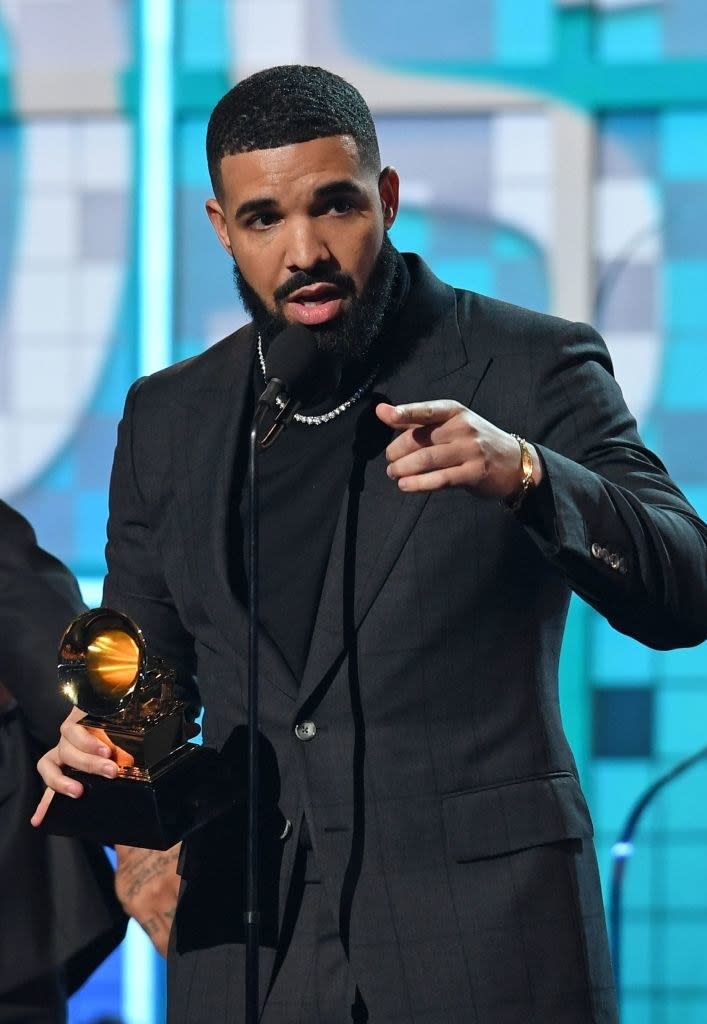 Drake onstage accepting a Grammy Award