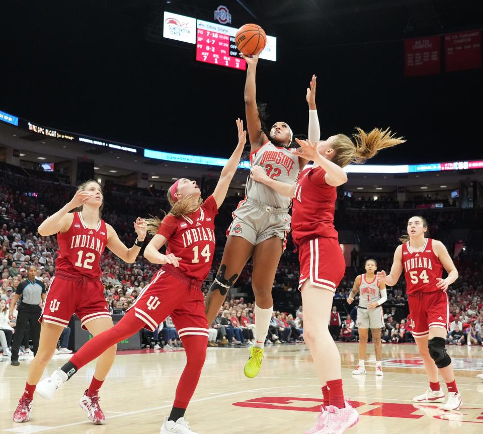 Ohio State forward Cotie McMahon shoots against Indiana's Yarden Garzon (12), Sara Scalia (14) and Lenee Beaumont (5) on Sunday. McMahon had 20 points and seven rebounds in the game.