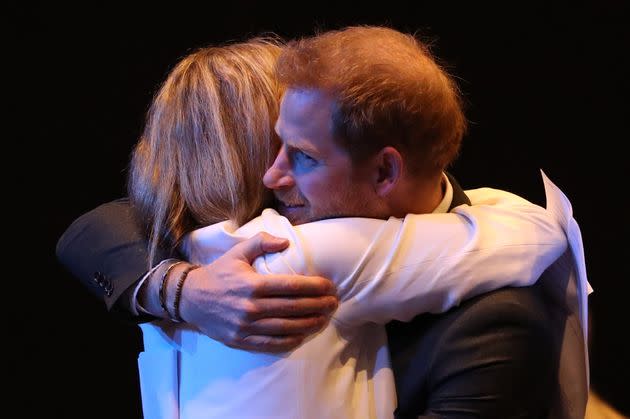 The Duke of Sussex receives a hug as he greets guests at a sustainable tourism summi on Feb. 26, 2020 in Edinburgh, Scotland.