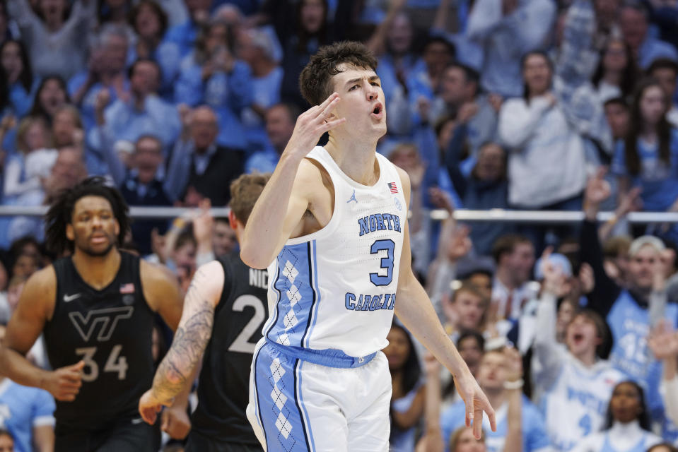 North Carolina's Cormac Ryan (3) reacts after hitting a 3-point basket during the second half of an NCAA college basketball game against Virginia Tech in Chapel Hill, N.C., Saturday, Feb. 17, 2024. (AP Photo/Ben McKeown)