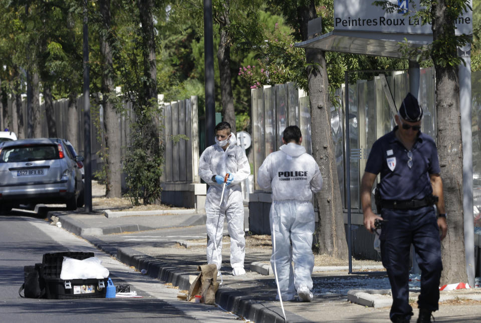 <p>French police officers inspect a bus stop in La Valentine district after a van rammed into two bus stops in the French port city of Marseille, southern France, Aug.21, 2017. (Photo: Claude Paris/AP) </p>