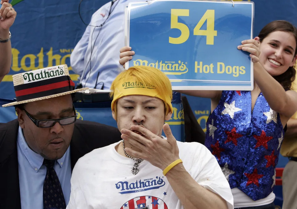 Six-time champion Takeru Kobayashi of Japan takes part in the 2006 Nathan's Famous Hot Dog Eating Contest.