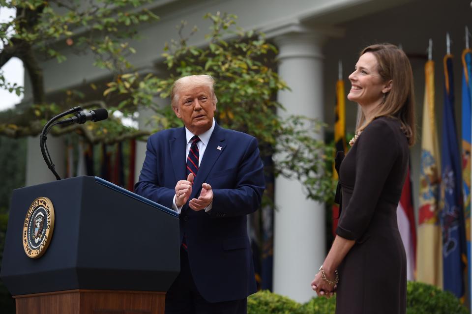 Supreme Court nominee Amy Coney Barrett laughs as President Trump nominates her Saturday at the White House. (AFP via Getty Images)