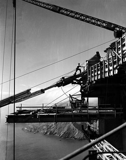 Workers at the top of the tower, which will support the $35,000,000 suspension bridge, are shown during construction of one of the catwalks for the Golden Gate Bridge in San Francisco, Ca., Oct. 17, 1935. Below in background is the Marin County shore, which will be connected to San Francisco by the bridge. (AP Photo)