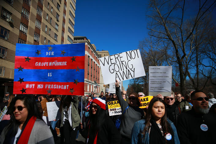 <p>Demonstrators holds up signs during the “Not My President’s Day” rally at Central Park West in New York City on Feb. 20, 2017. (Gordon Donovan/Yahoo News) </p>