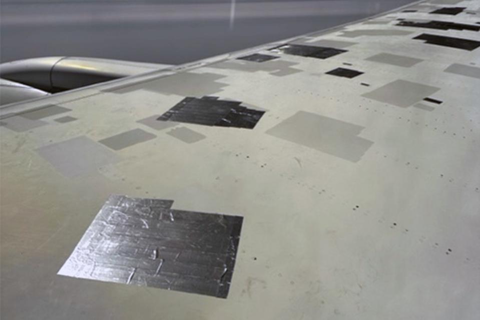 UK passenger David Parker grew alarmed after noticing pieces of tape on the wing of a Boeing 787 during a flight to India, as seen in shocking photos. David Parker / SWNS