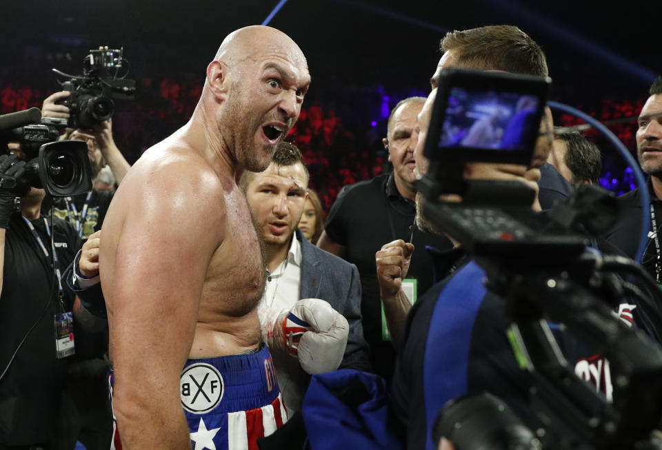 Tyson Fury, of England, celebrates after defeating Tom Schwarz, of Germany, in a heavyweight boxing match Saturday, June 15, 2019, in Las Vegas. (AP Photo/John Locher)