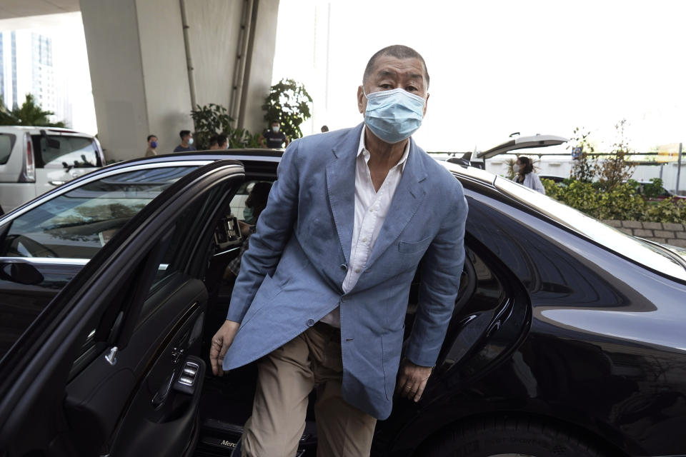 In this Thursday, Oct. 15, 2020 photo, Jimmy Lai arrives at a court in Hong Kong. Jimmy Lai, the pro-democracy Hong Kong media tycoon who was arrested during a crackdown on dissent was charged Wednesday Dec. 2, 2020, with fraud but no national security offenses, two newspapers reported. Jimmy Lai of Next Digital, which owns the Apple Daily newspaper, was among 10 people arrested Aug. 10 on what police said was suspicion of violating a national security law and collusion with a foreign country. Lai, 71, was later released on bail but police raided his company's offices in October. (AP Photo/Kin Cheung)