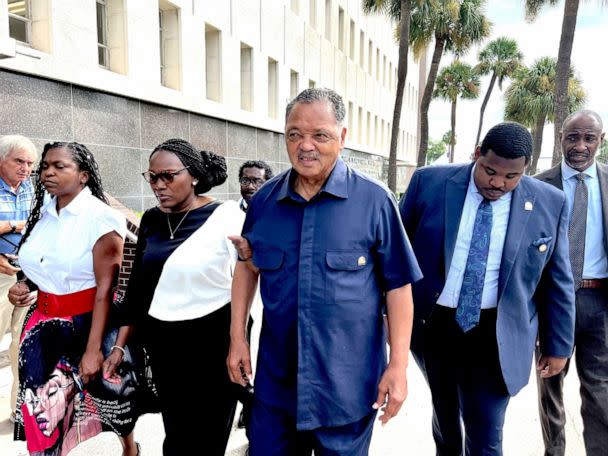 PHOTO: Rev. Jesse Jackson escorts Wanda Cooper Jones, second from left, Ahmaud Arbery's mother, into the courthouse, Aug. 8, 2022, in Brunswick, Ga., for the sentencing hearings of the 3 white men convicted of federal hate crimes in the killing of Arbery. (Lewis M. Levine/AP)