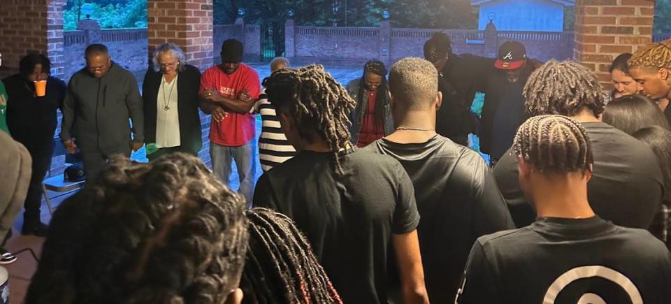 South Carolina cornerback Cam Smith huddles with his friends and family to pray before the first round of the NFL draft began on Thursday night.