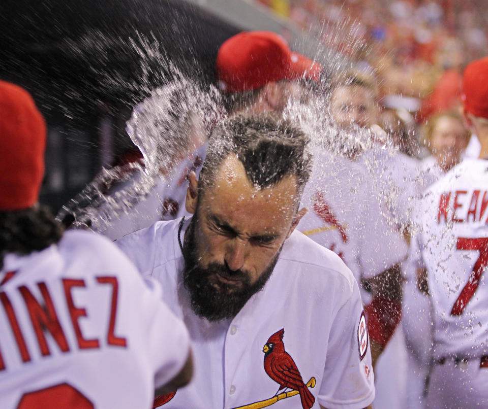 St. Louis Cardinals' Matt Carpenter gets a face full of water as he celebrates a three-run home run in the eighth inning of a baseball game against the Washington Nationals, Monday, Aug. 13, 2018, in St. Louis. The Cardinals defeated the Nationals 7-6. (AP Photo/Tom Gannam)