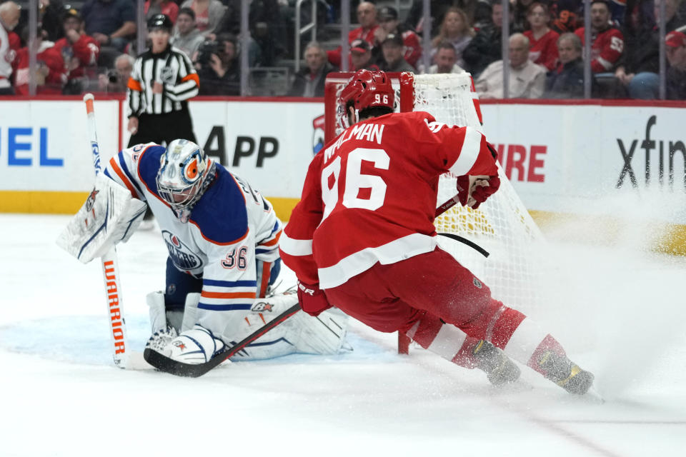 Edmonton Oilers goaltender Jack Campbell (36) stops a Detroit Red Wings defenseman Jake Walman (96) shot in the second period of an NHL hockey game Tuesday, Feb. 7, 2023, in Detroit. (AP Photo/Paul Sancya)