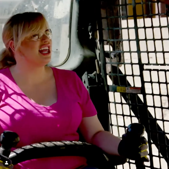 Rebel Wilson operates a bobcat during friend Nicole Leal's backyard transformation on HGTV's 'Celebrity IOU'