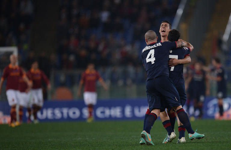 Cagliari's forward Marco Sau celebrates with teamates after scoring against AS Roma during their Serie A football match in Rome's Olympic Stadium on Febuary 1, 2013. Zdenek Zeman's future as coach of AS Roma was placed in further doubt Friday after the Serie A side suffered a 4-2 reverse at home to lowly Cagliari for their fifth straight game without a win