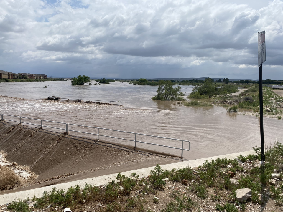 Flooding of Dark Canyon at San Jose Blvd on June 29, 2021 closes the intersection and causes flooding of Pecos River in Carlsbad.