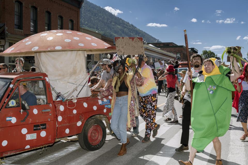 “We’re like family, and this is where we come together,” said John Michelotti (at right). Michelotti, who runs the Catskill Fungi company in upstate New York, dressed up as Corn Smut fungus for the parade.