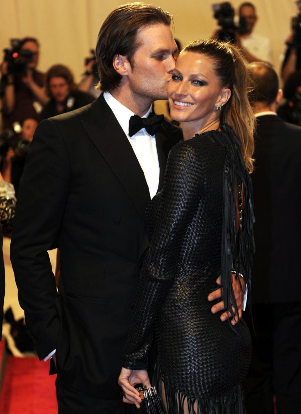 <b>May 3, 2010</b><br>  Tom Brady kisses Gisele Bundchen at the <i>American Woman: Fashioning a National Identity</i> Met Gala in New York, NY, USA (AFP/Getty Images)