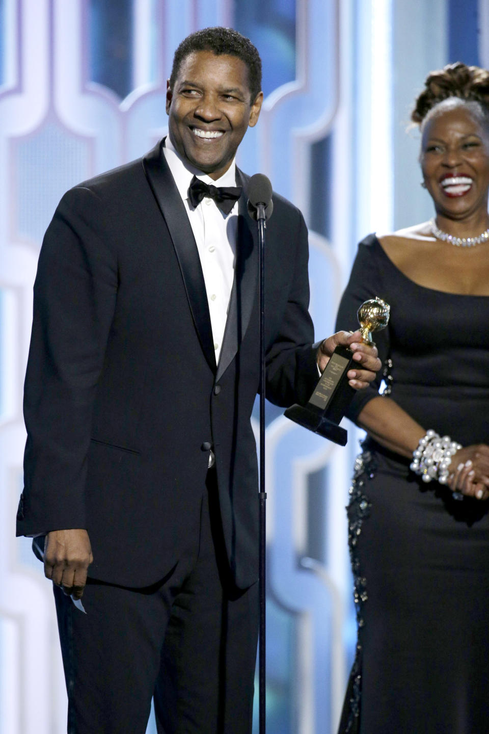 BEVERLY HILLS, CA - JANUARY 10: In this handout photo provided by NBCUniversal,  Denzel Washington accepts with Cecil B. Demille Award during the 73rd Annual Golden Globe Awards at The Beverly Hilton Hotel on January 10, 2016 in Beverly Hills, California.  (Photo by Paul Drinkwater/NBCUniversal via Getty Images)