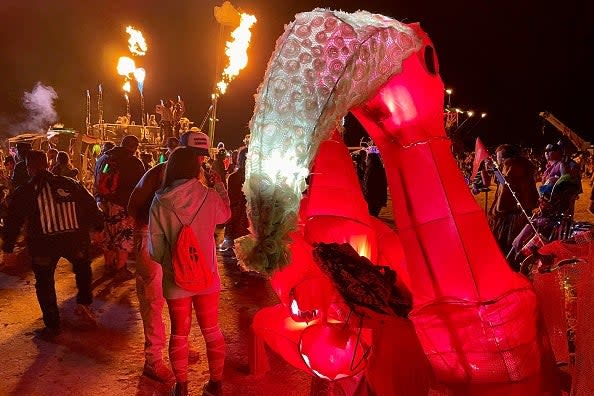 Attendees gather during the annual Burning Man Festival on September 4, 2023. Thousands of revelers stuck in the mud for days at the Burning Man festival in the US state of Nevada were told they could finally trek home on September 4, 2023 (AFP via Getty Images)