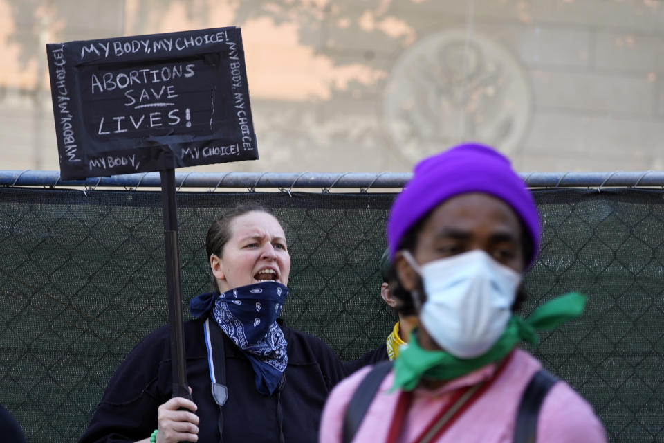 Supporters of abortion rights hold a rally outside the First Street U.S. Courthouse, Central District of California, in downtown Los Angeles, Saturday, June 25, 2022. The U.S. Supreme Court's decision to end constitutional protections for abortion has cleared the way for states to impose bans and restrictions on abortion — and will set off a series of legal battles. (AP Photo/Damian Dovarganes)