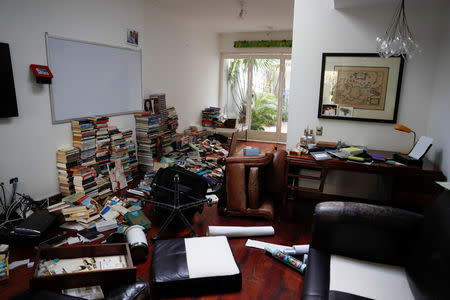 Books and personal belongings are seen on the floor of the residence of opposition leader Leopoldo Lopez and his family, after unidentified government officials illegally entered the house, according to the family's lawyer Omar Mora Tosta, in Caracas, Venezuela May 2, 2019. REUTERS/Carlos Garcia Rawlins