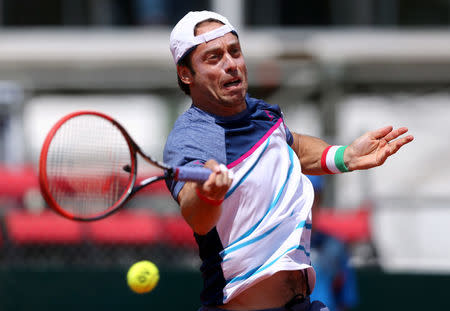 Tennis - Argentina v Italy - Davis Cup World Group First Round - Parque Sarmiento stadium, Buenos Aires, Argentina - 3/2/17. Italy's Paolo Lorenzi plays a shot to Argentina's Guido Pella. REUTERS/Marcos Brindicci